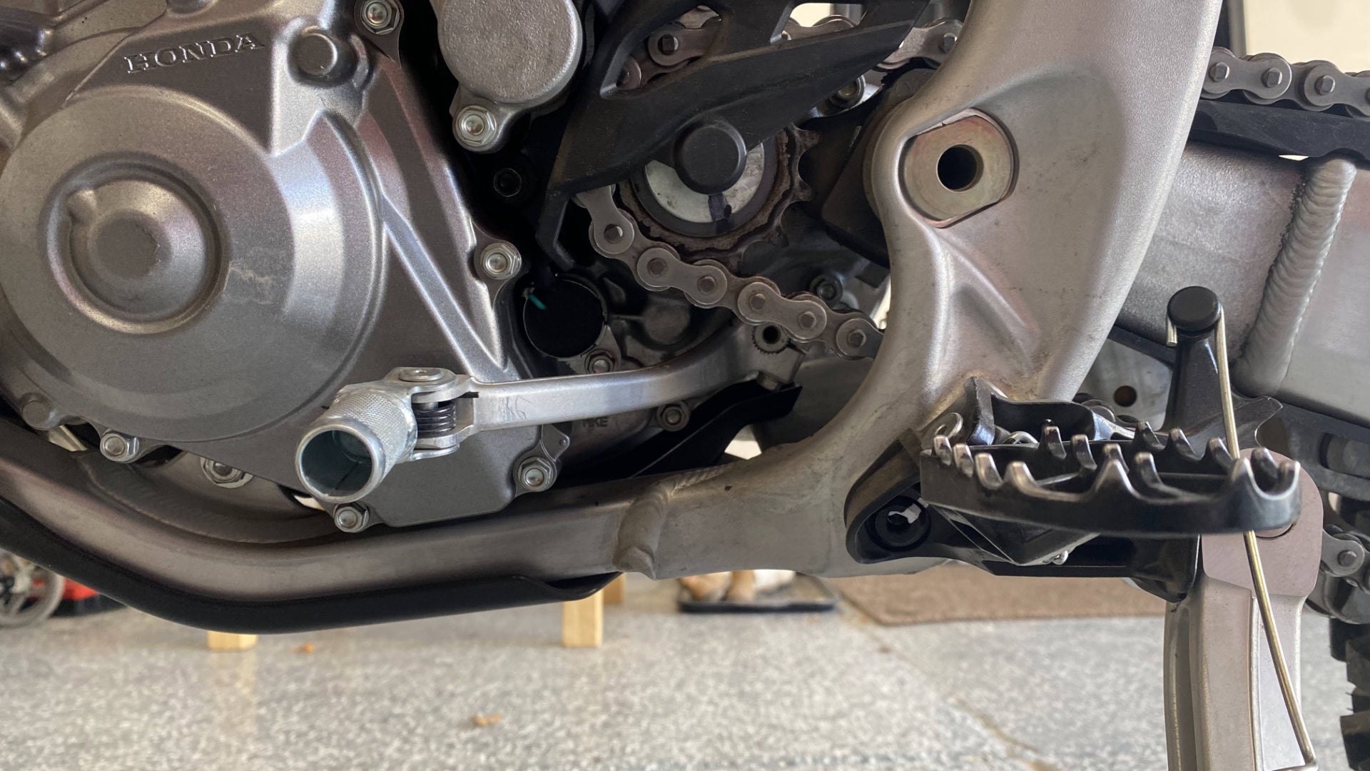 The countershaft sprocket behind the shifter and foot peg., <i>Jonathon Klein</i>