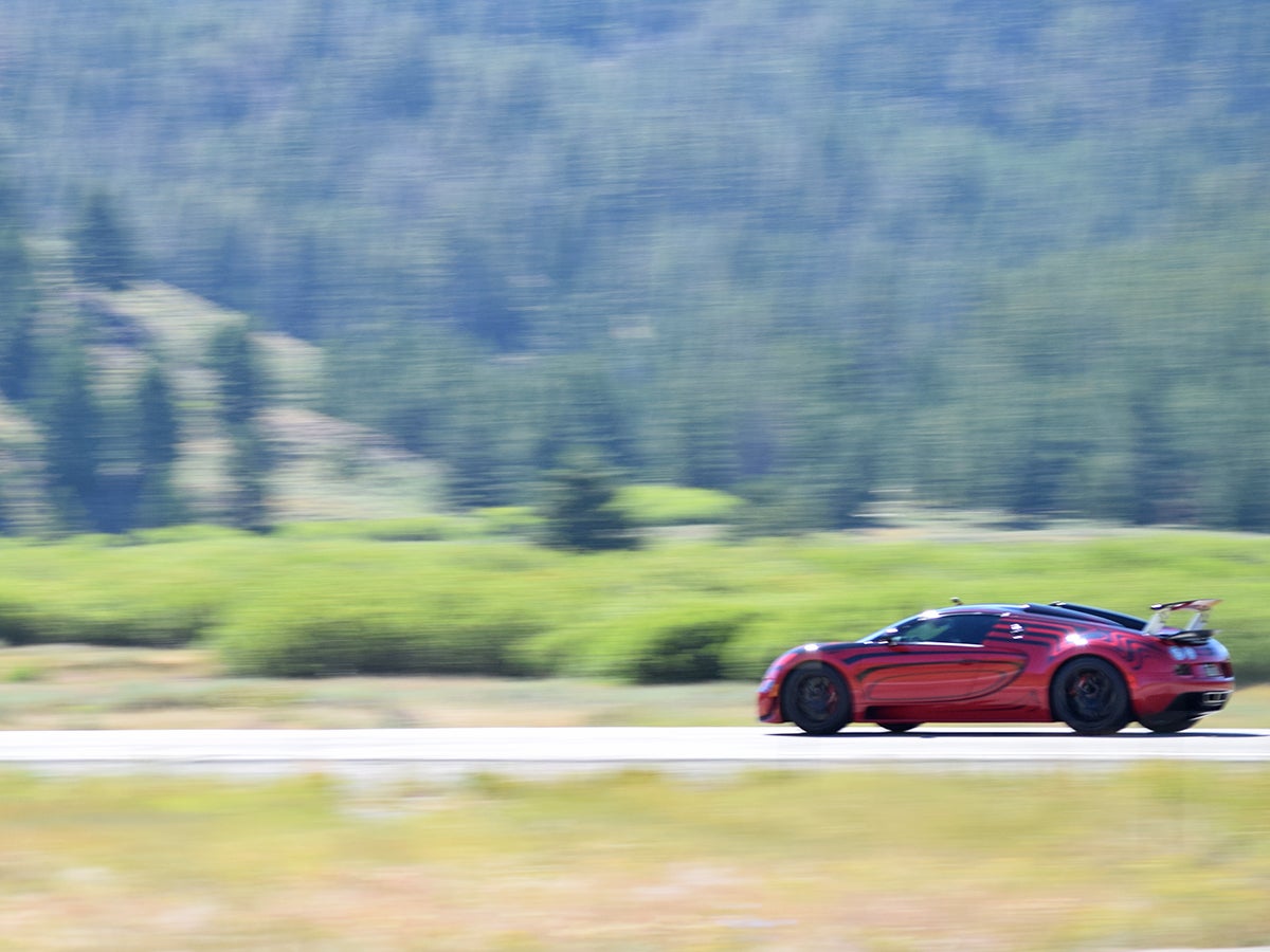 Hey, you try taking a picture of a Bugatti Veyron as it shoots by at 230 mph.
