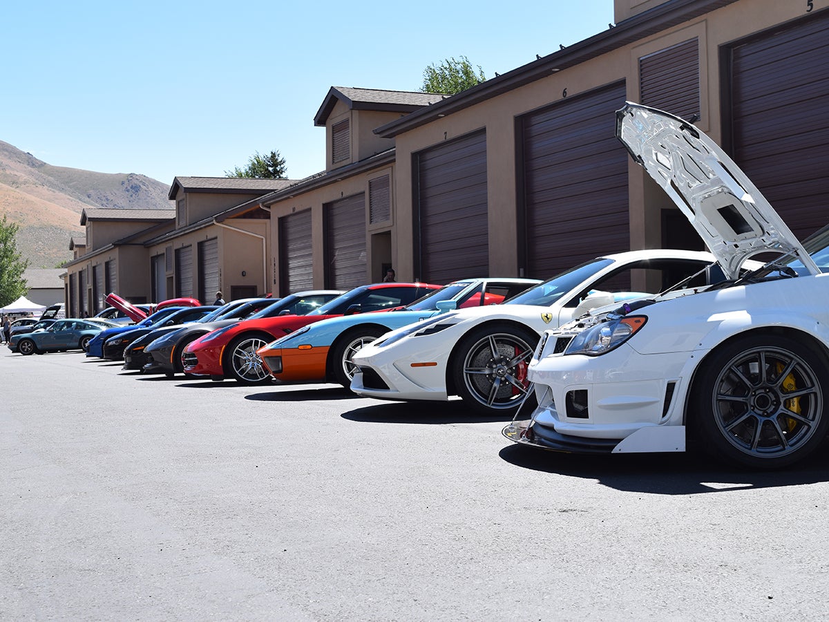 A small portion of the gathered sports cars lines up at the pre-event technical inspection.