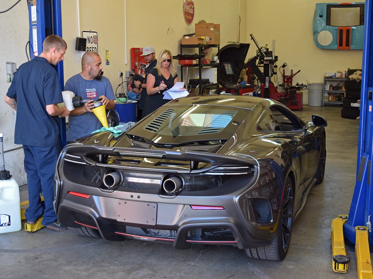 One of two McLaren 675LTs in the competition is topped off with racing fuel.