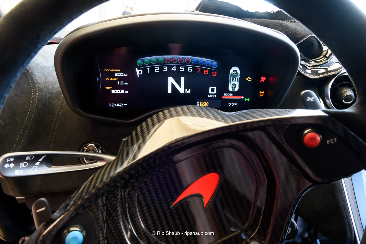 The dash cluster is surprisingly high-tech for a dedicated race car. Snowhorn’s also includes four built in cameras and a fully integrated telemetry system. Also visible is the pit lane speed-limiter button on the carbon fiber steering wheel. On the left are the push-to-talk radio controls., <i>© Richard Shaub. All Rights reserved</i>