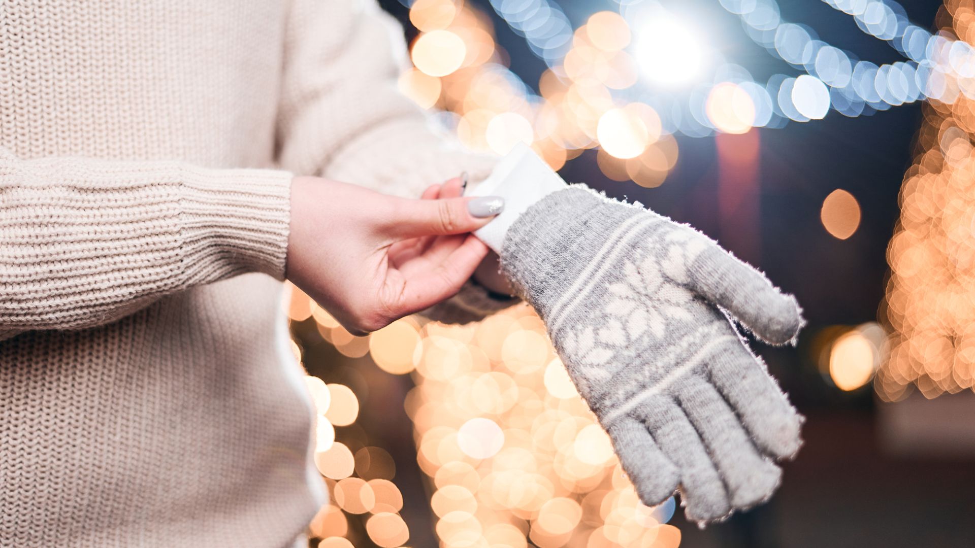 Hand warmers slipping into a glove.