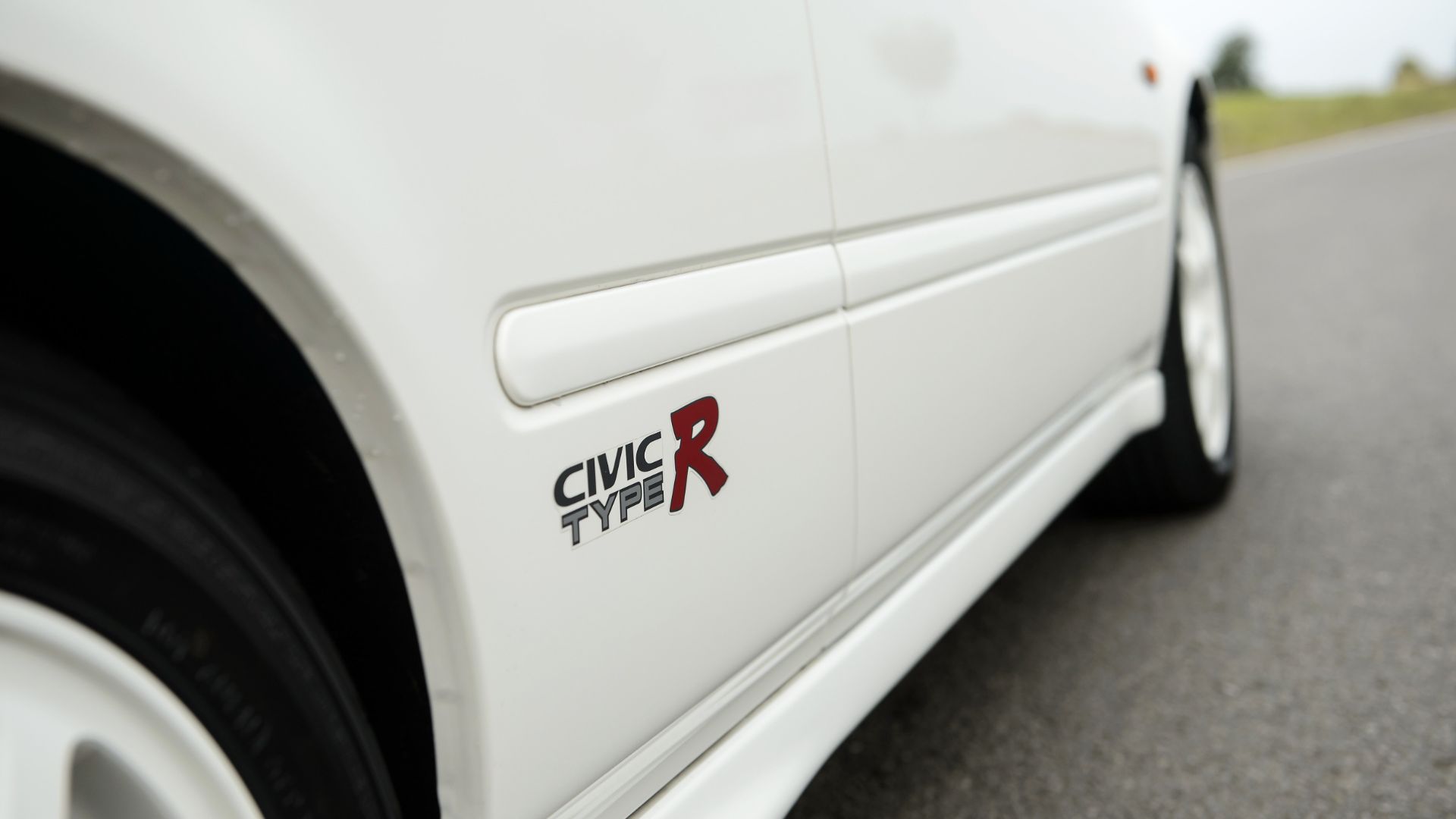 A Civic Type R logo.
