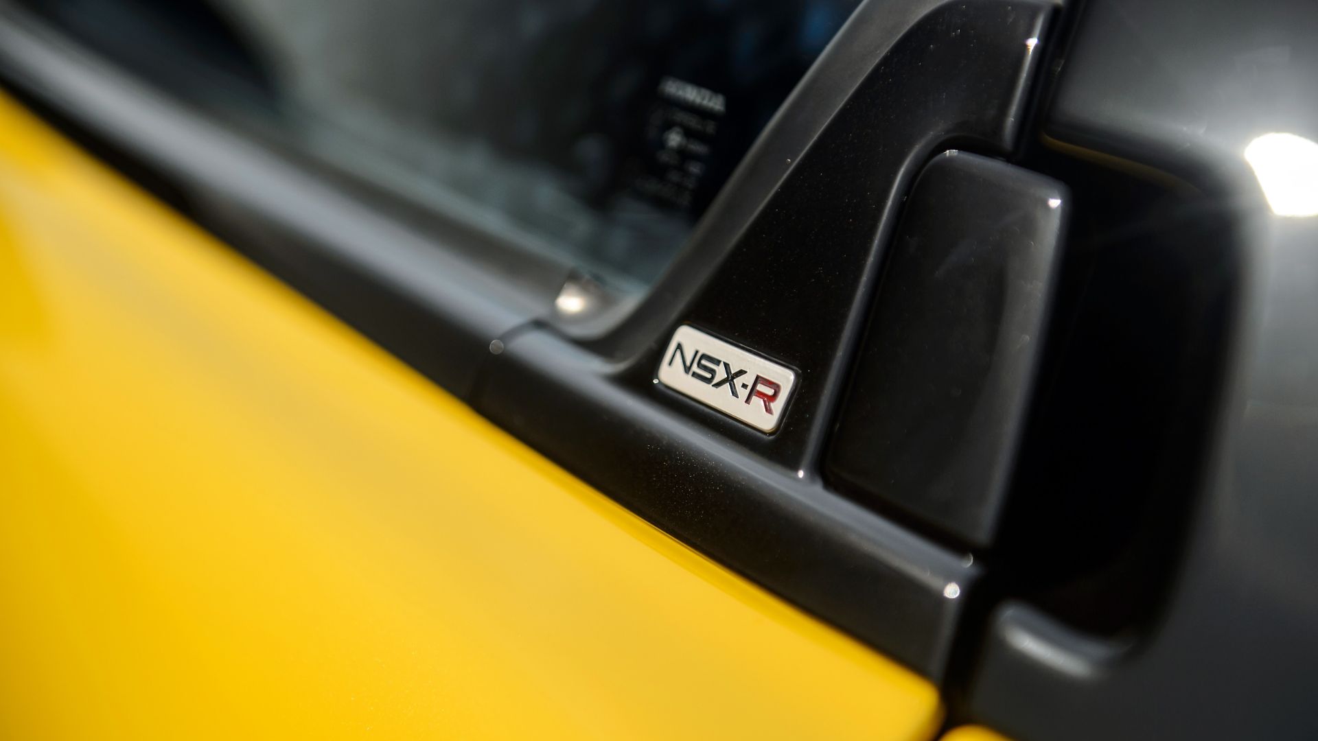 An NSX-R badge. 
