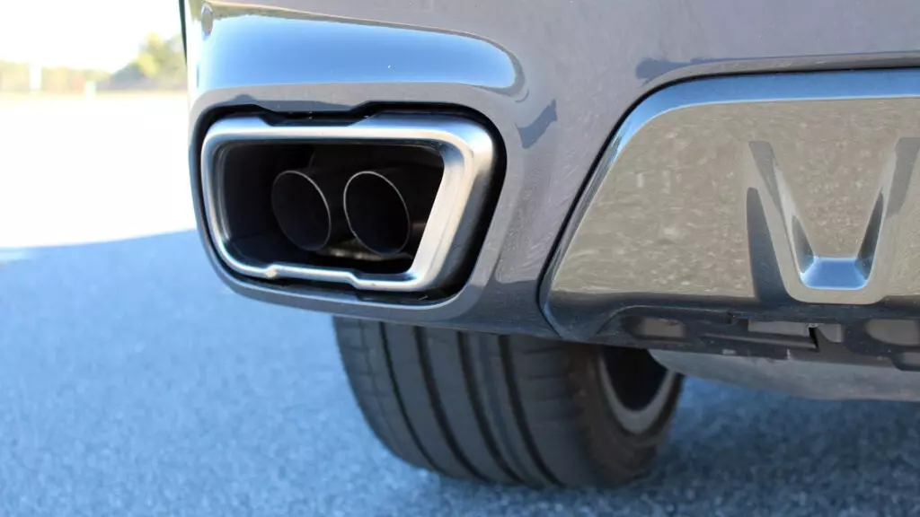 A close-up of a BMW X6 M50i exhaust tip.