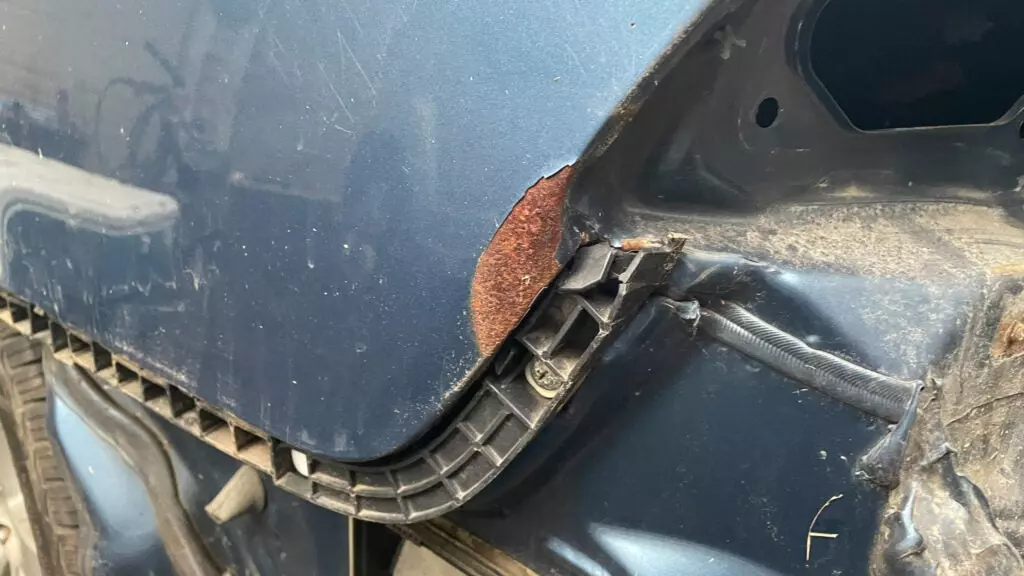 Honda Civic quarter panel rusty divot