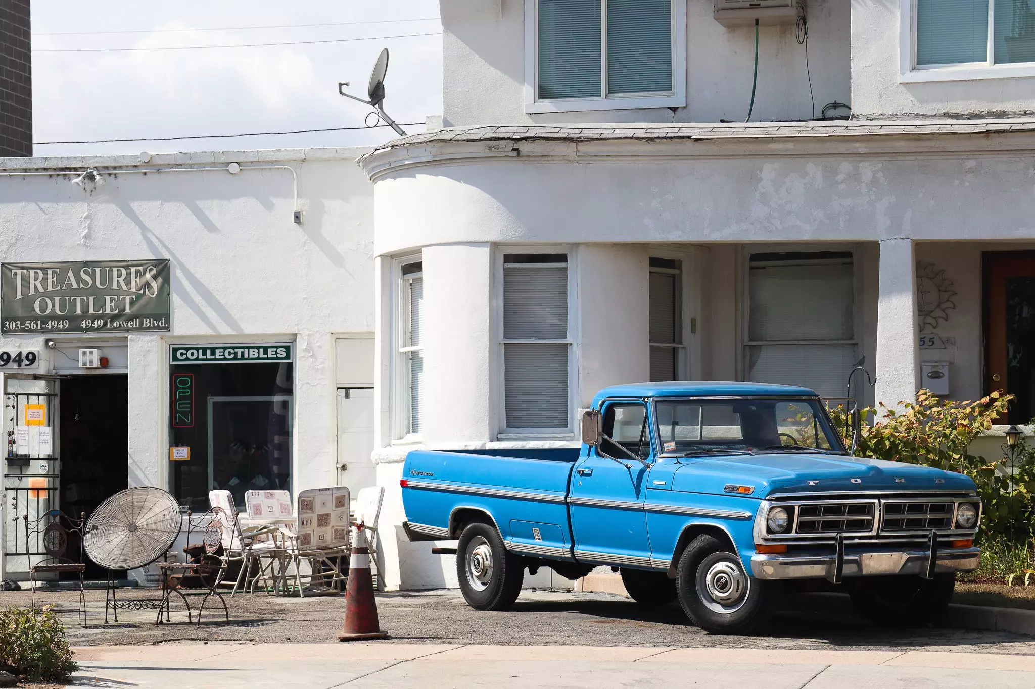 Can You Think of a Better Vehicle Parked Next to an Antique Store?