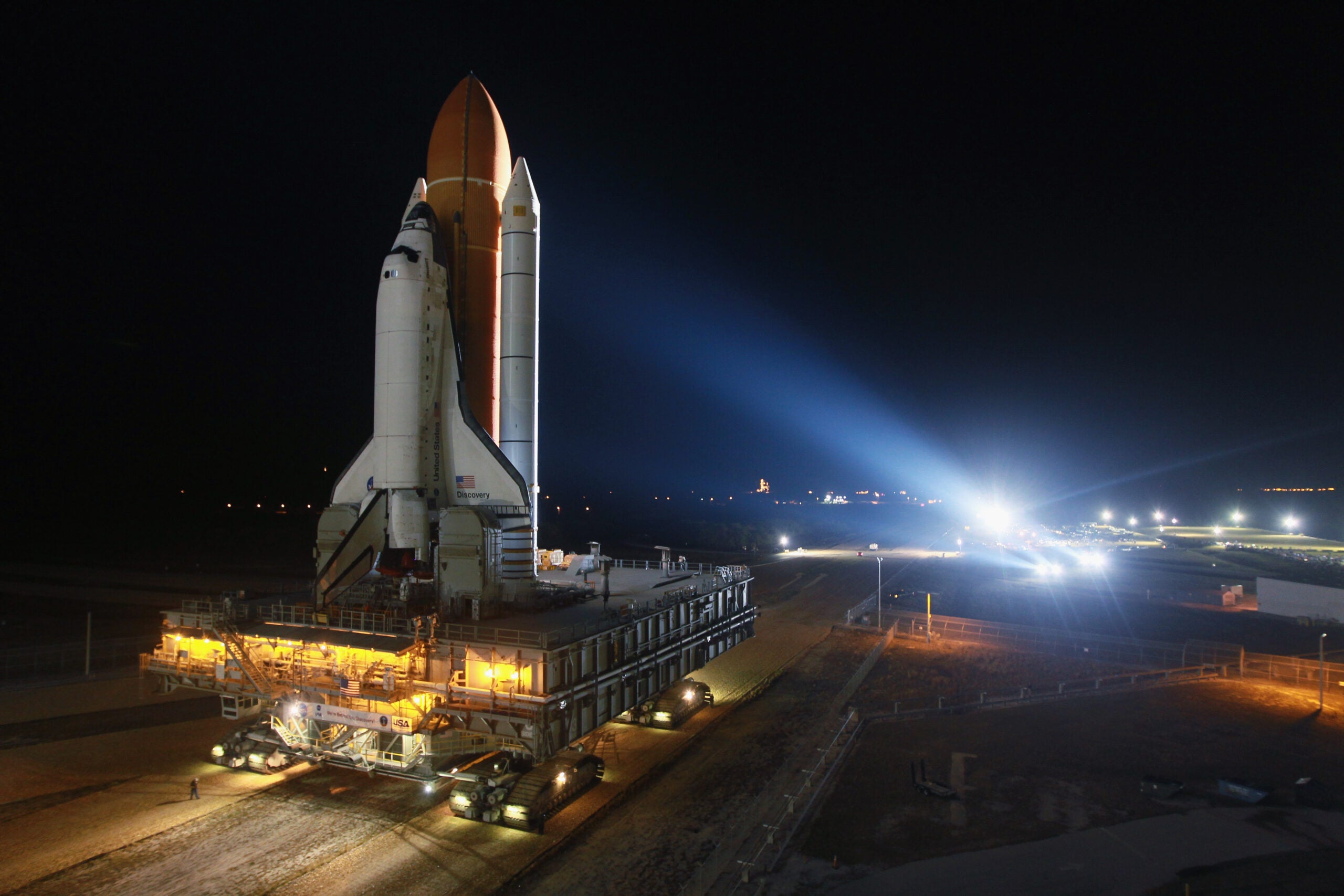 Space shuttle Discovery rolls to the launch pad after emerging from NASA