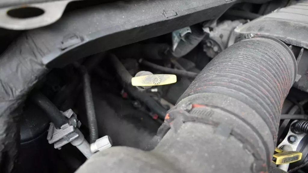 A transmission dipstick in the engine compartment.
