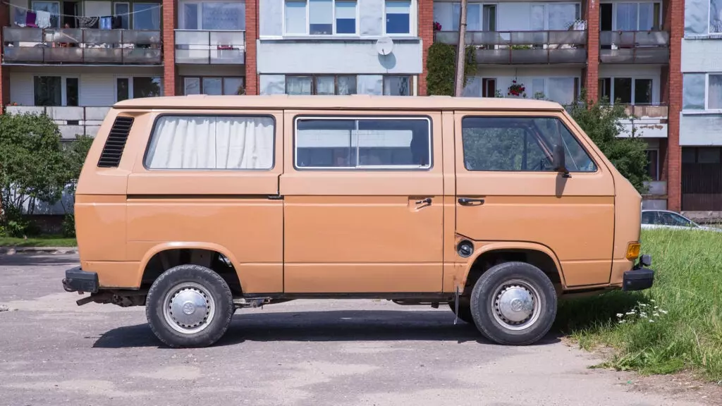 A side view of a VW camper van.