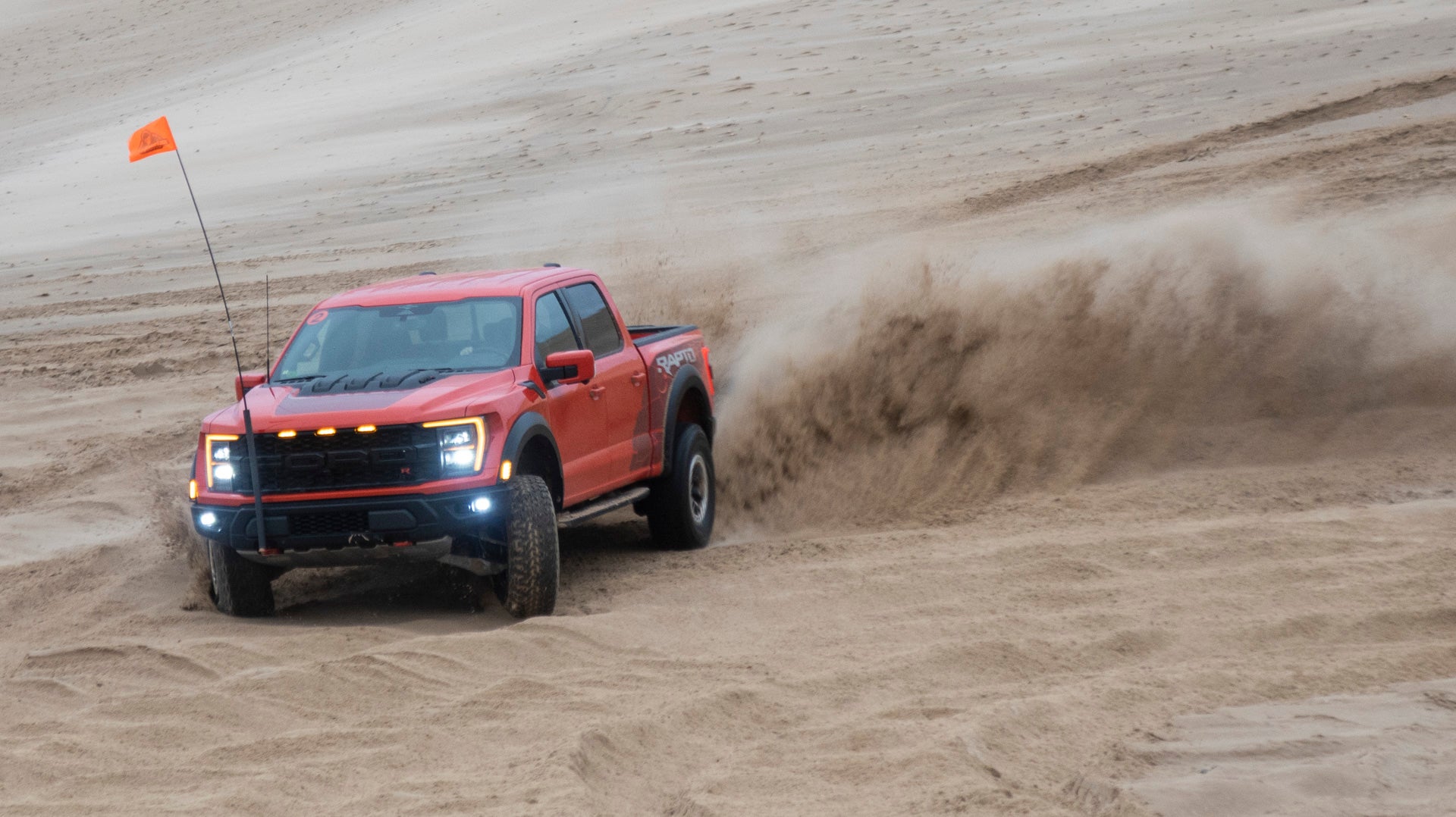 2023 Ford F-150 Raptor R doing donuts.