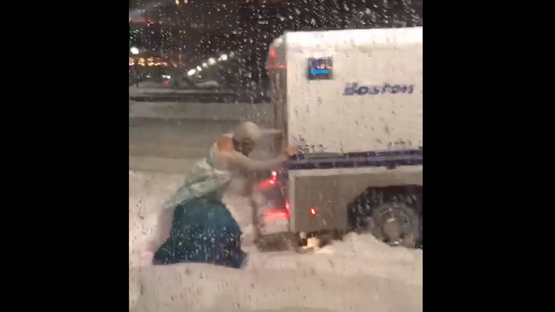 Watch Man Dressed as Elsa From <em>Frozen</em> Help Boston Police Van Get Un-Stuck in Nor’easter