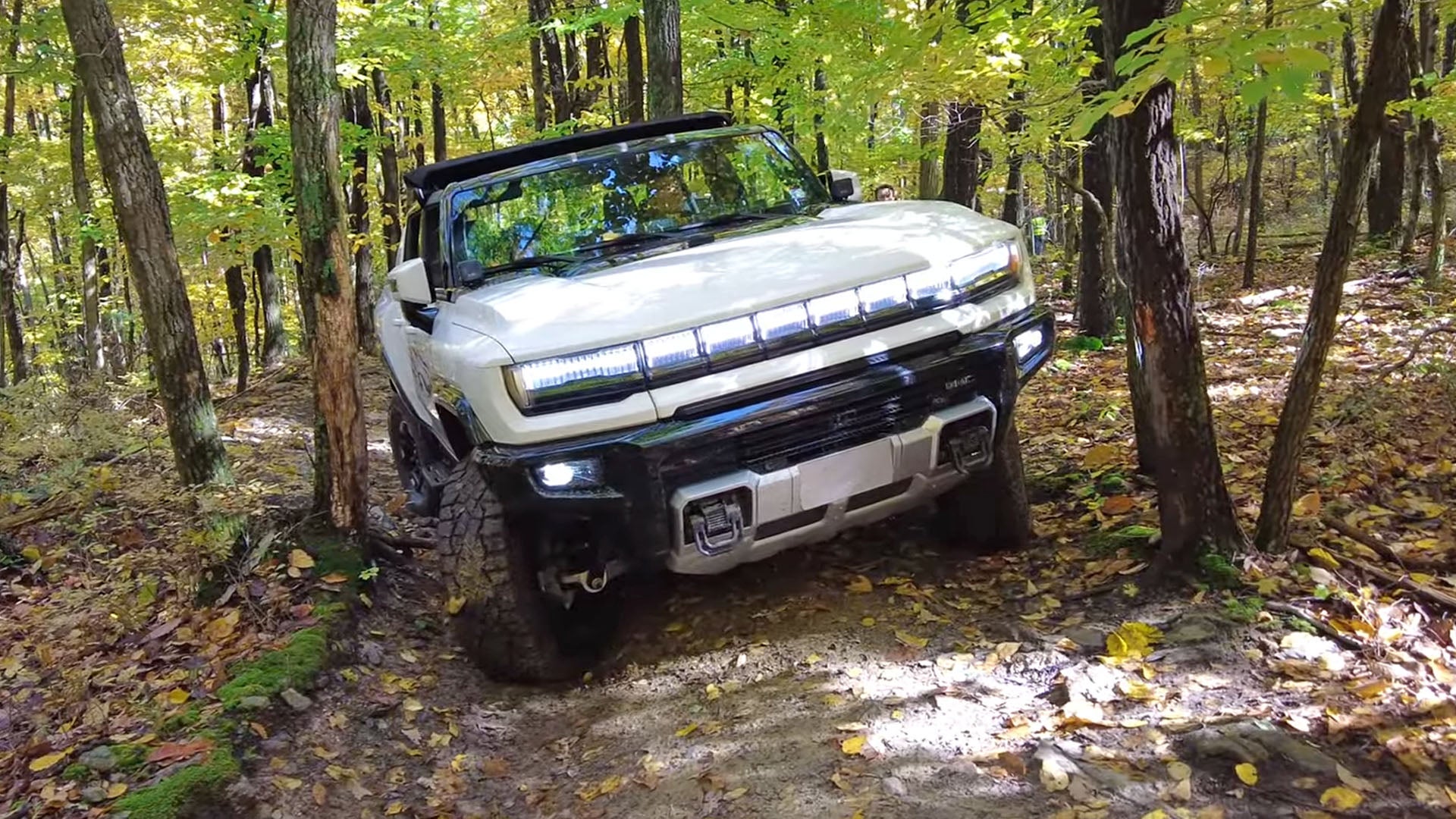 Watch a GMC Hummer EV Go Head to Head With a Classic H1 on Tight Trails