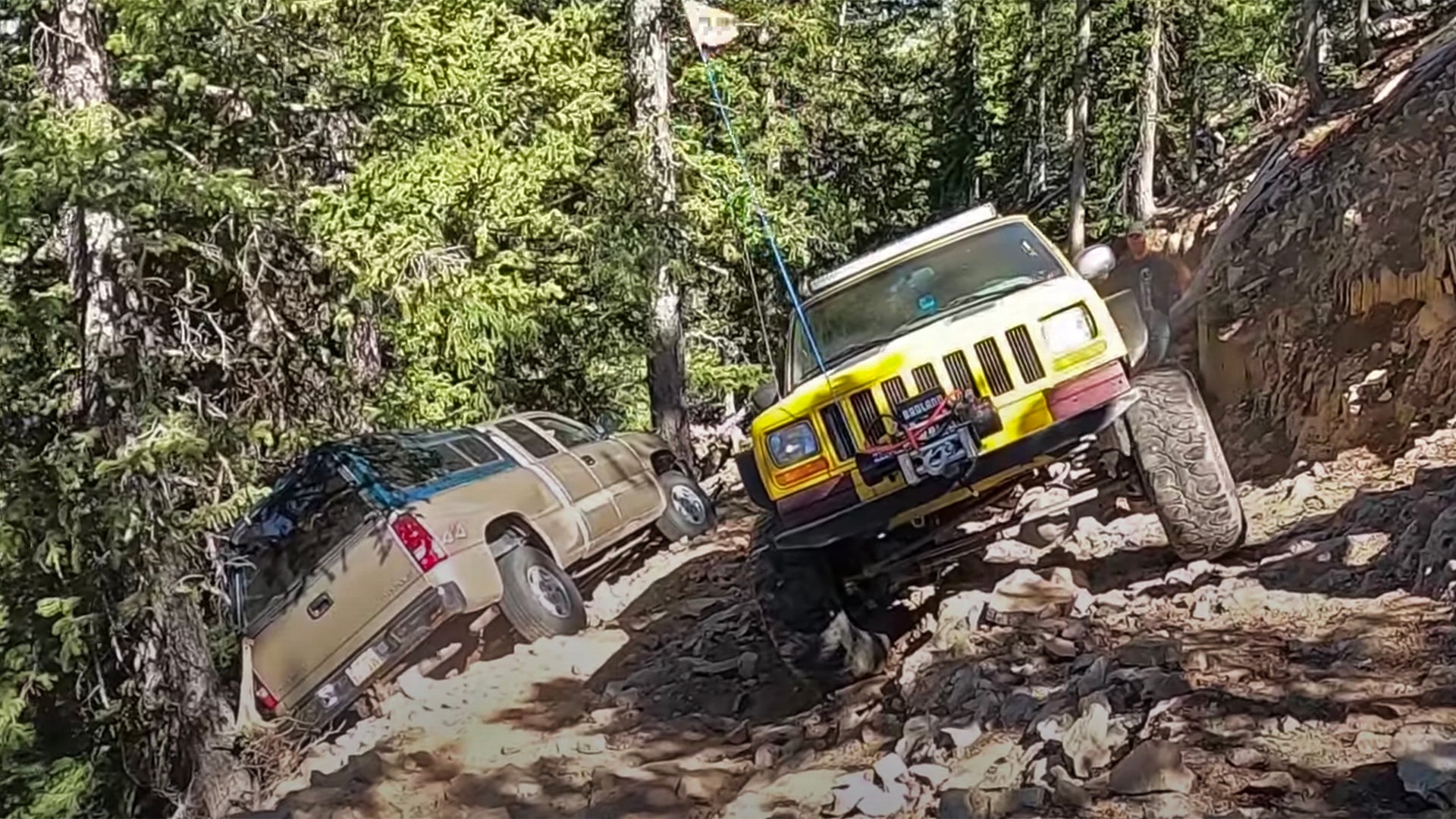 Watch This Off-Road Recovery Crew Rescue a Chevy Silverado Dangling off the Edge of a Mountain